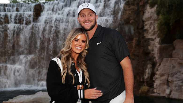 Brittany Williams and Josh Allen near a waterfall