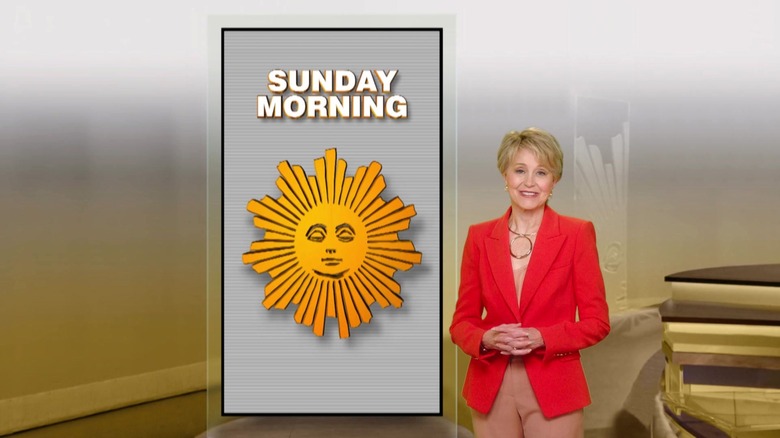 Jane Pauley in front of the CBS Sunday Morning logo, a sleepy sun