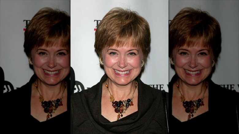 Jane Pauley smiling and wearing a black and amber statement necklace, circa 2007