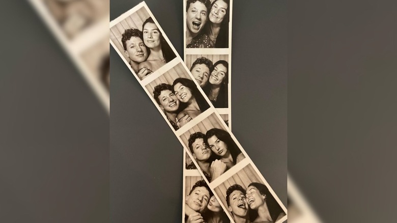 Charlie Puth and Brooke Sansone pose in a photobooth
