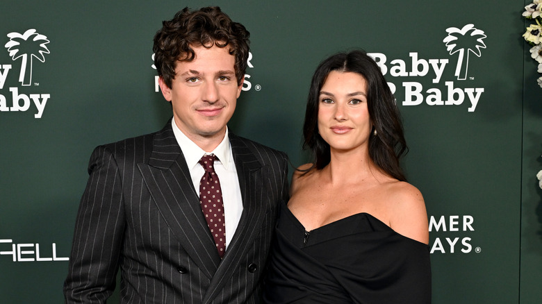 Charlie Puth and Brooke Sansone pose on the red carpet