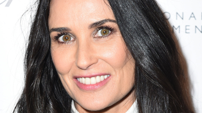 Demi Moore smiles at an event 