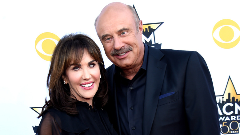 Robin McGraw and Dr. Phil McGraw posing at an event