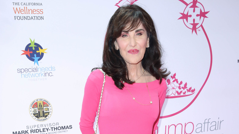 Robin McGraw posing at an event