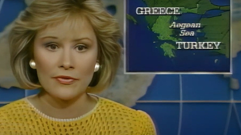Faith Daniels wearing yellow and presenting for CBS News in 1987