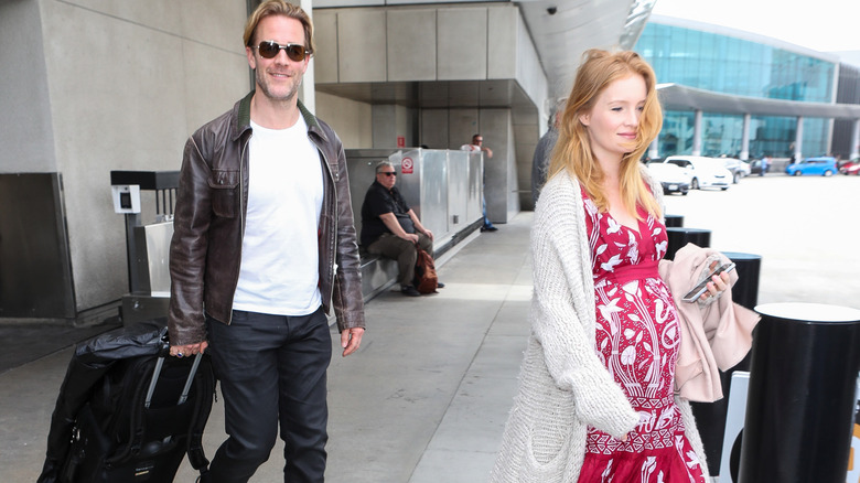 James Van Der Beek and Kimberly Van Der Beek exiting an airport
