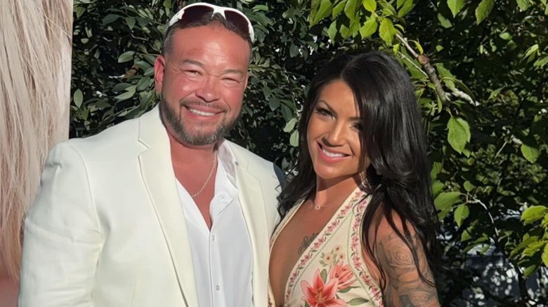 Jon Gosselin and Stephanie Lebo smiling outside in front of greenery