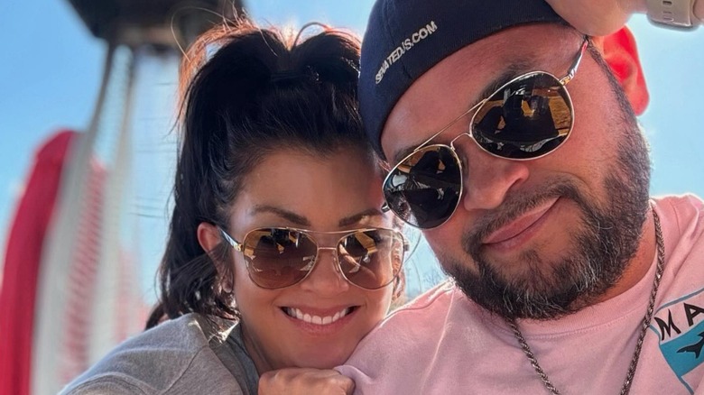 Closeup of Stephanie Lebo and Jon Gosselin smiling in sunglasses