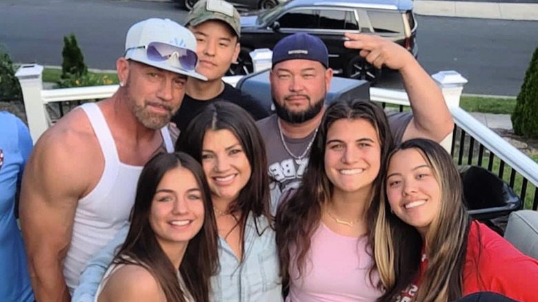 Jon Gosselin and Stephanie Lebo smiling surrounded by family and friends
