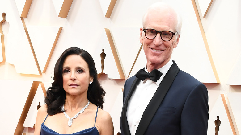 Julia Louis-Dreyfus and Brad Hall posing