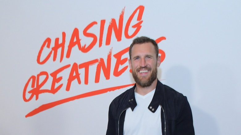 Brooks Laich standing in front of a logo for Chasing Greatness