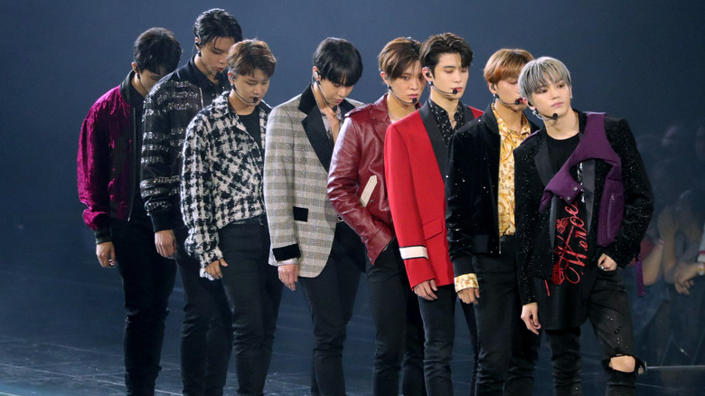 NCT 127 appears on stage with blazers