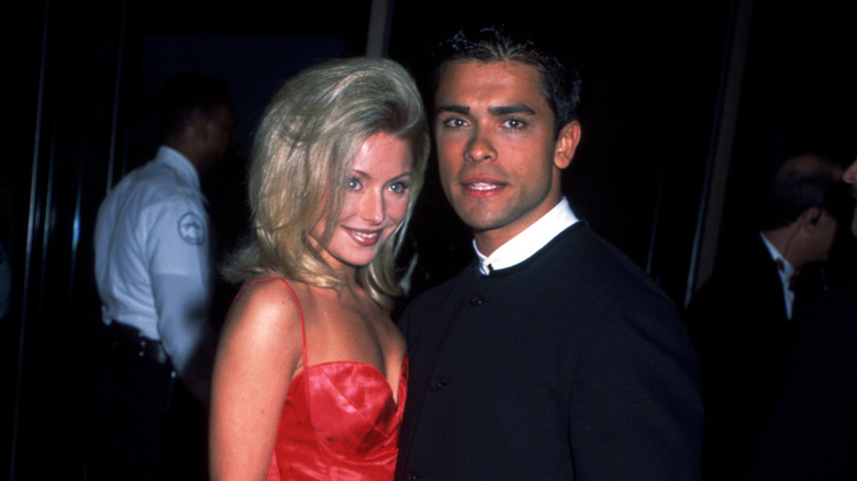 Mark Consuelos and Kelly Ripa posing at an event