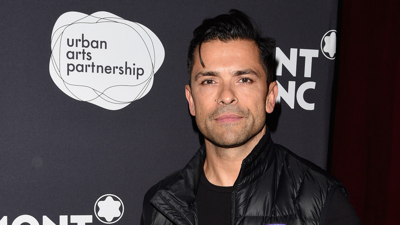 Mark Consuelos posing at a charity event
