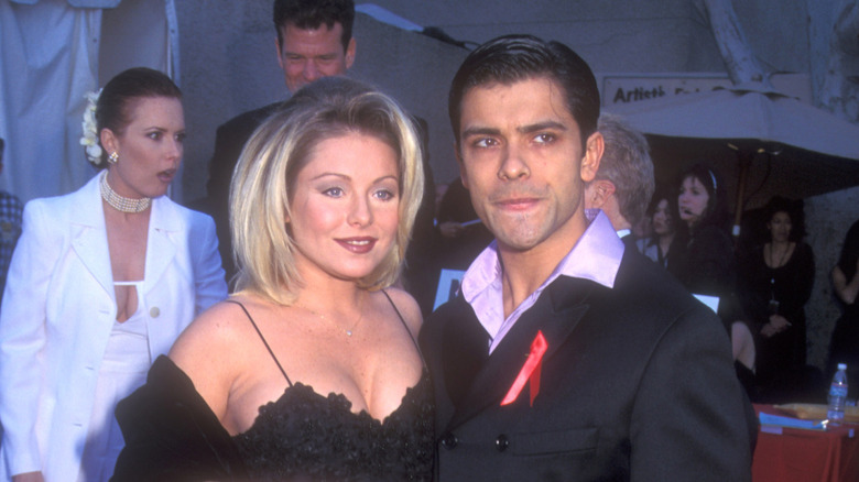 Kelly Ripa and Mark Consuelos on a red carpet