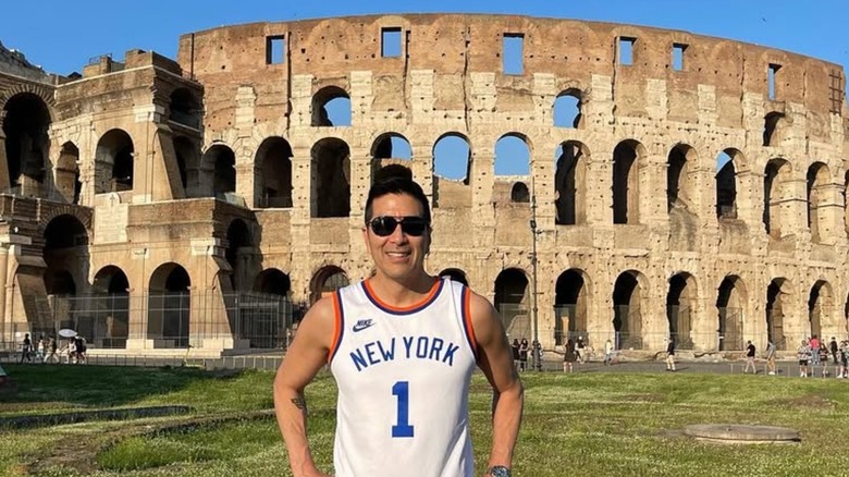 Paul Song posing in front of the coliseum