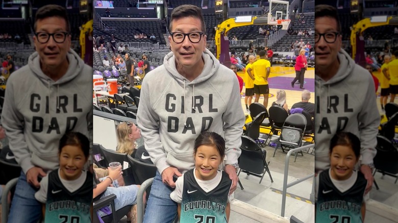 Paul Song with his daughter at a basketball game