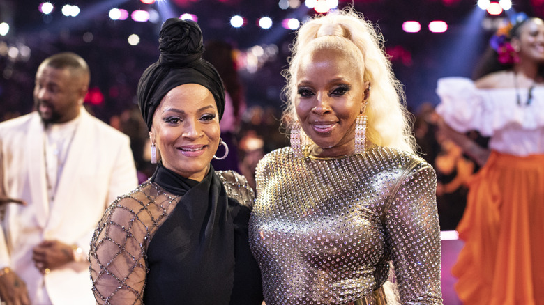 Mary J. Blige and Simone I. Smith posing at an awards event