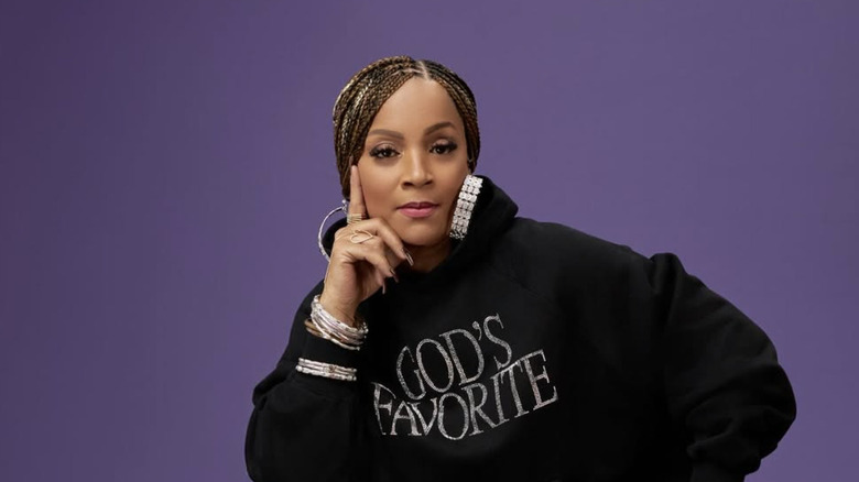 Simone I. Smith wearing a hoodie that says God's Favorite