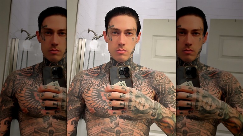 Trace Cyrus taking a shirtless mirror selfie clutching money