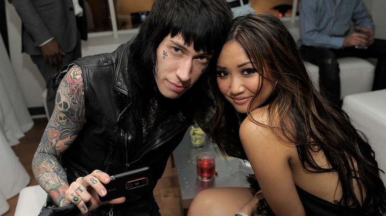Trace Cyrus and Brenda Song posing together at an event