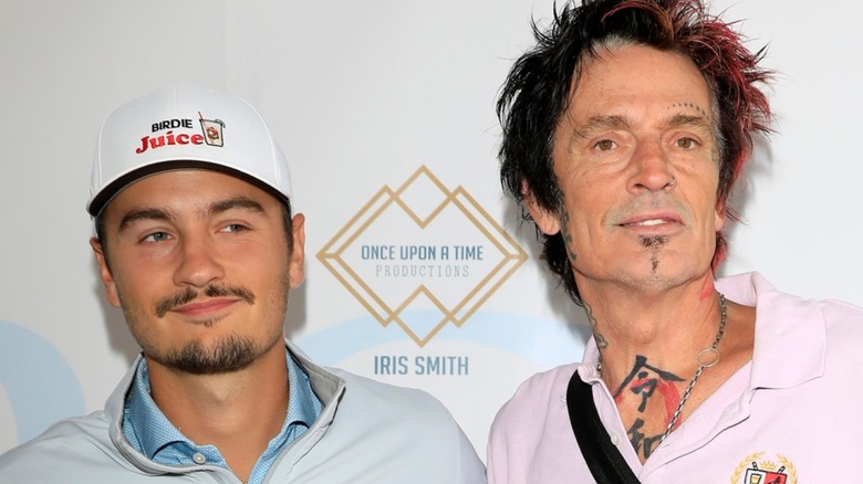 Brandon Thomas Lee and Tommy Lee together on a step-and-repeat
