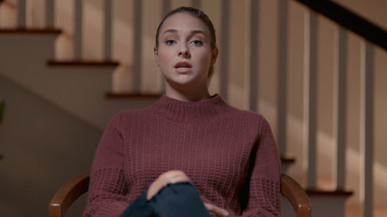 Paul Murdaugh's ex-girlfriend, Morgan Doughty Bostick, sits for an interview inside wearing a red sweater with her hair pulled back