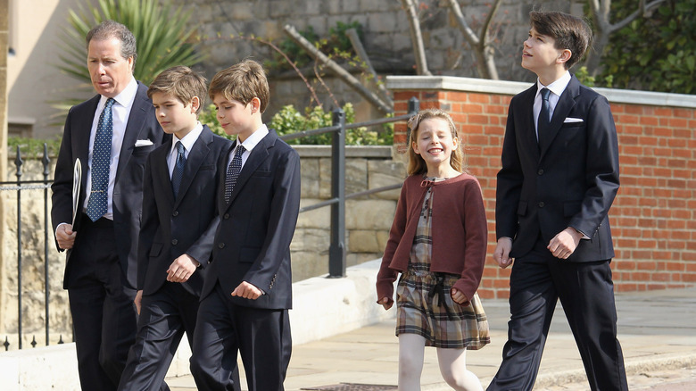 David Armstrong-Jones, Margarita Armstrong-Jones, Charles Armstrong-Jones, Samuel Chatto, and Arthur Chatto walking outside