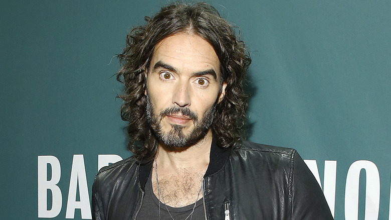 Russell Brand, Kirsty Gallacher posing at events