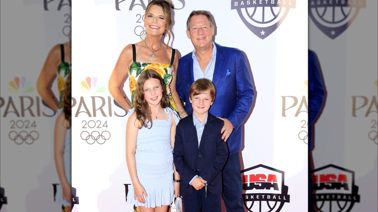 The Guthrie and Feldman with their two kids on a red carpet.