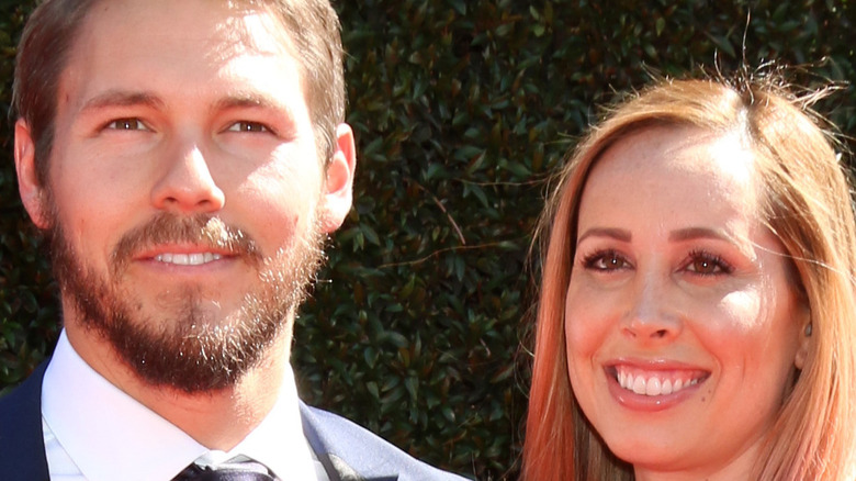 Scott Clifton and Nicole Lampson pose on the red carpet.