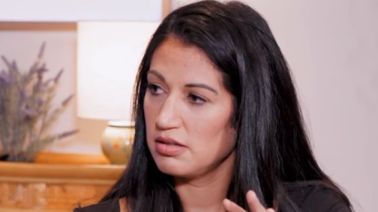 Katie Miller hosting her podcast