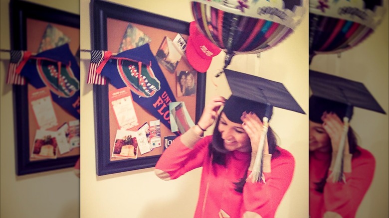 Katie Miller wearing a college graduation cap