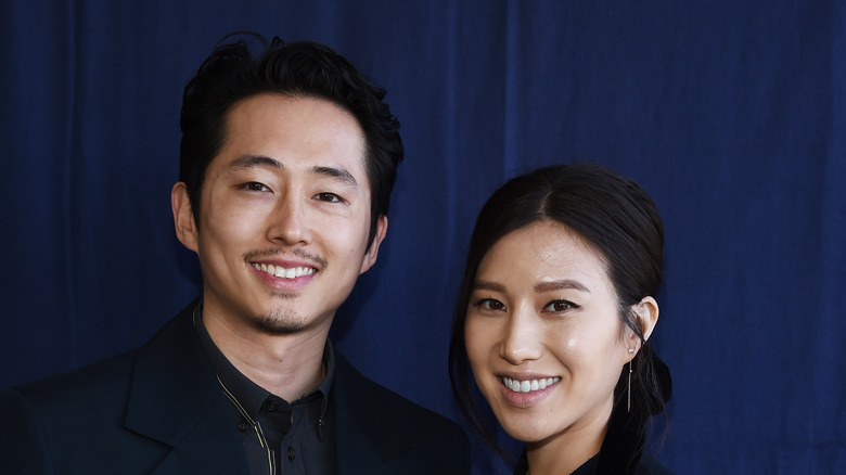 Steven Yeun, wife Joana Pak smiling
