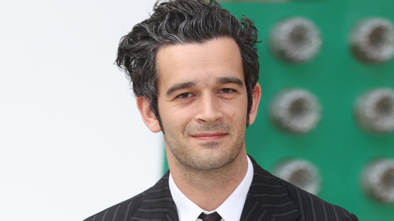 Matt Healy of The 1975 posing
