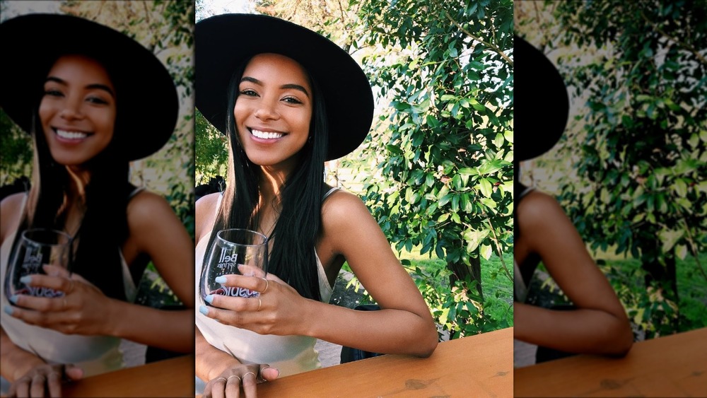 The Bachelor's Bri Springs poses with a glass of wine