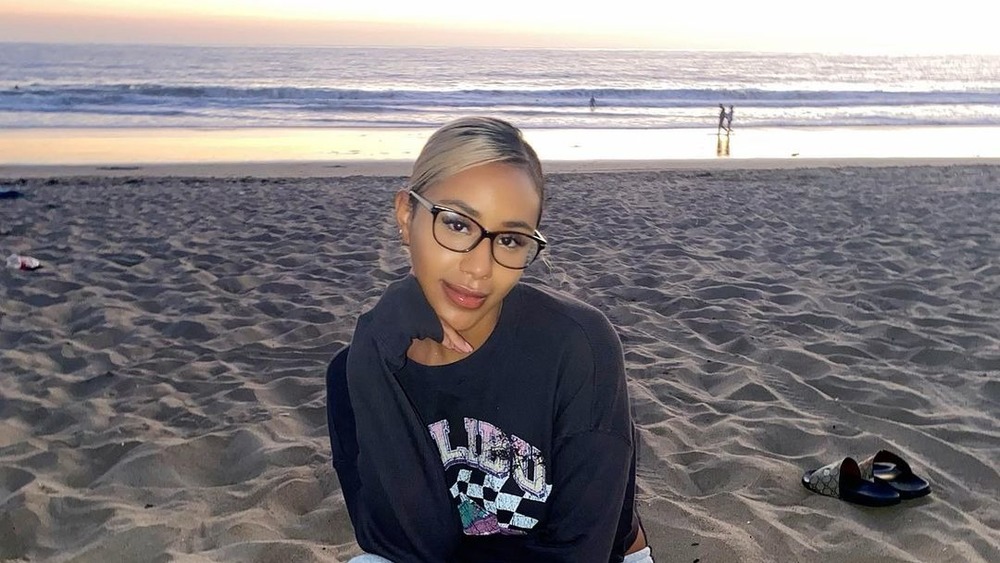 Emani Curl posing on the beach