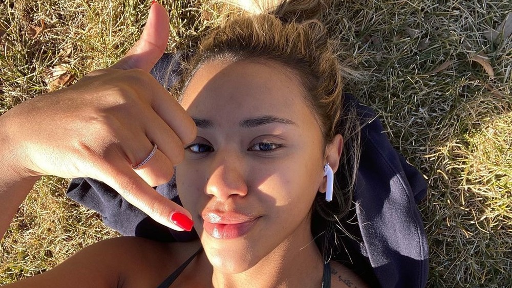 Emani Curl lying in the grass