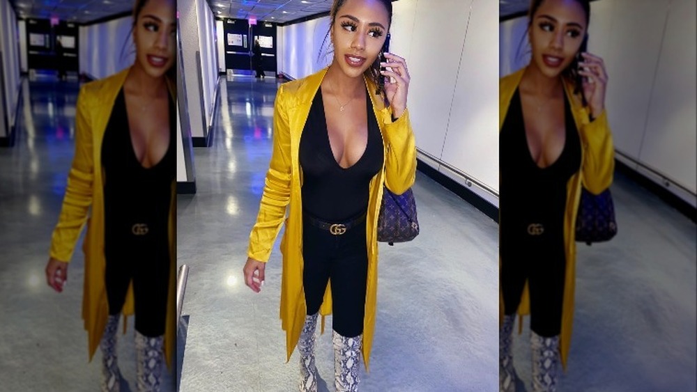 Emani Curl wearing yellow coat