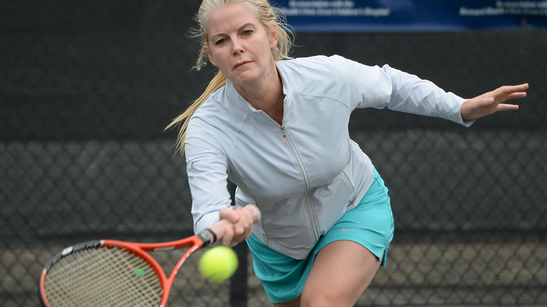Maeve Quinlan playing tennis in 2014