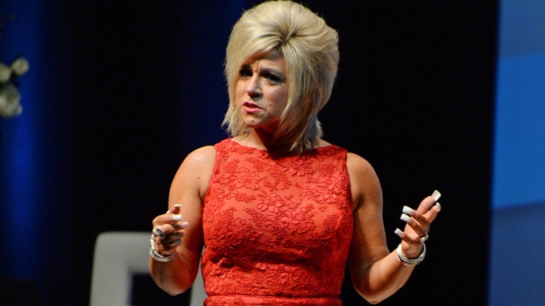 Theresa Caputo looking confused onstage