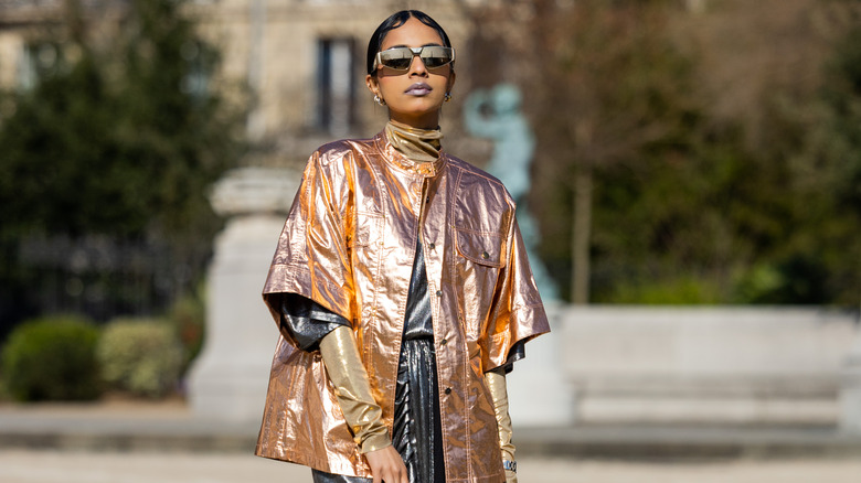 woman wearing metallic jacket and dress