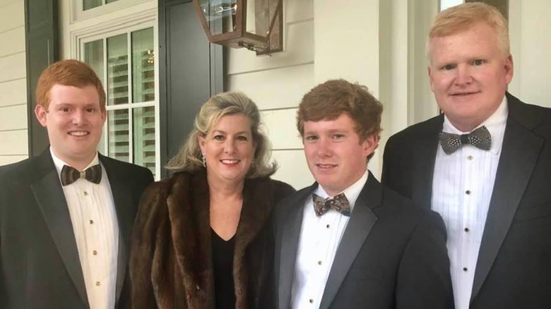 Maggie Murdaugh in fur coat with sons Buster, Paul, and husband Alex all in tuxes