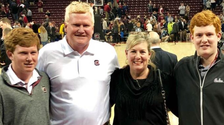 The Murdaugh family posing for a photo at basketball game