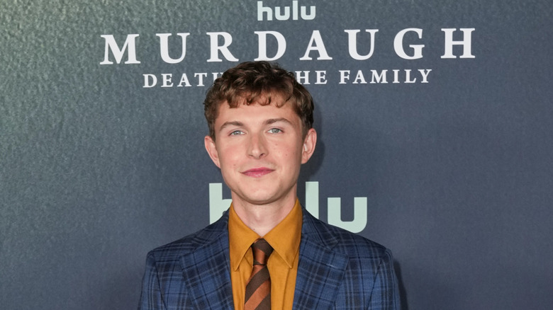 Johnny Berchtold poses at Hulu premiere step-and-repeat for "Murdaugh: Death in the Family"