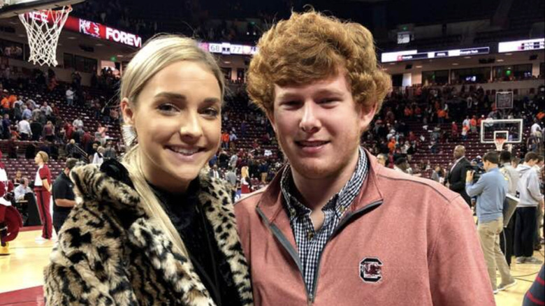 Morgan Doughty and Paul Murdaugh pose for a photo at basketball game