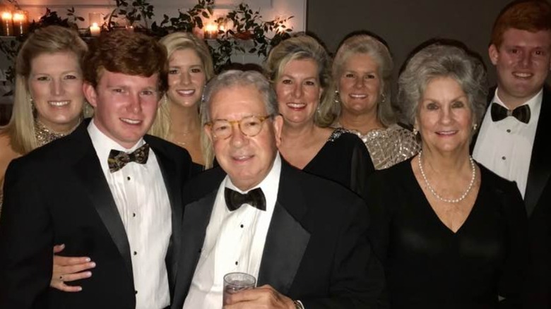 Paul Murdaugh smiling in tuxedo and surrounded by family members