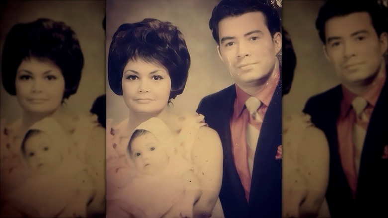 Kimberly Guilfoyle as an infant with her mother and father