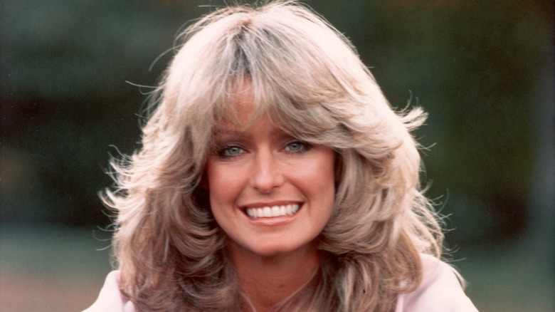 Farrah Fawcett posing outdoors