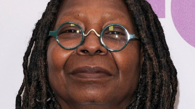 Whoopi Goldberg wearing tiny round glasses on the red carpet